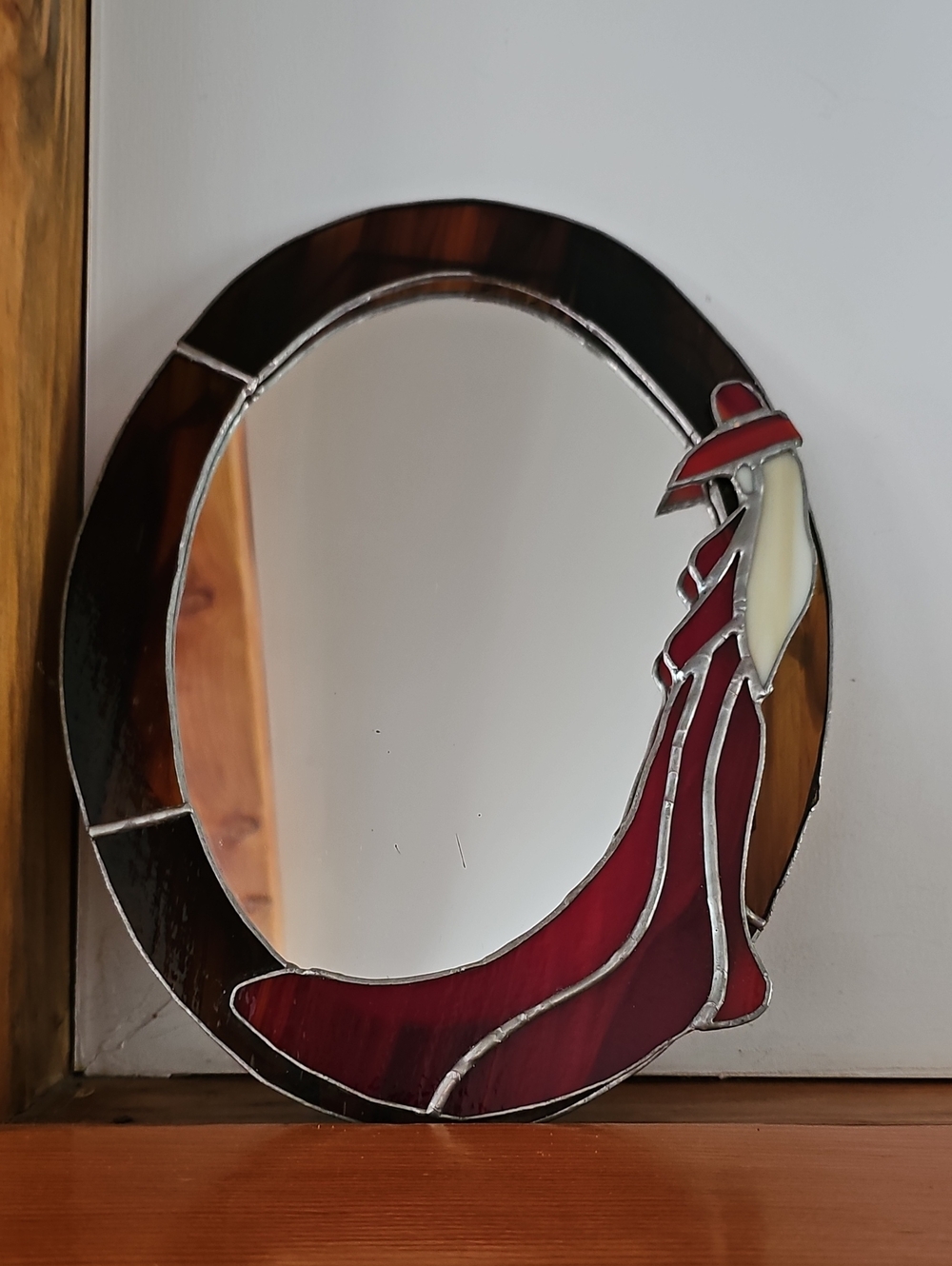 Hand Crafted Stained Glass Mirror with Red and Brown Dress Motif